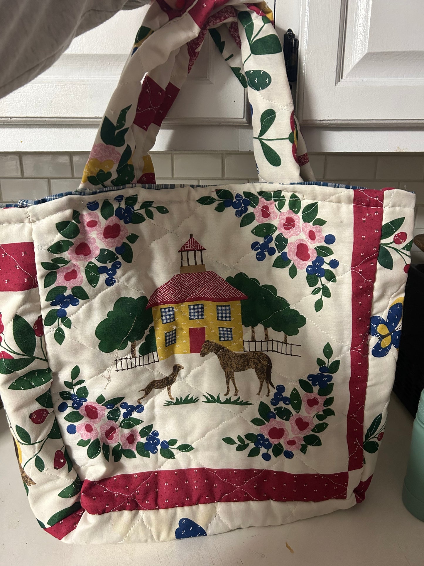 The schoolhouse quilted tote bag